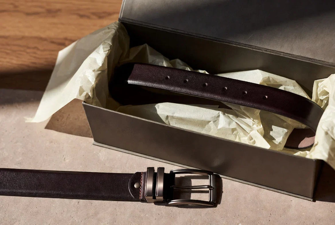 Premium leather belt beside an open belt box in a refined editorial setting AI Prompt: