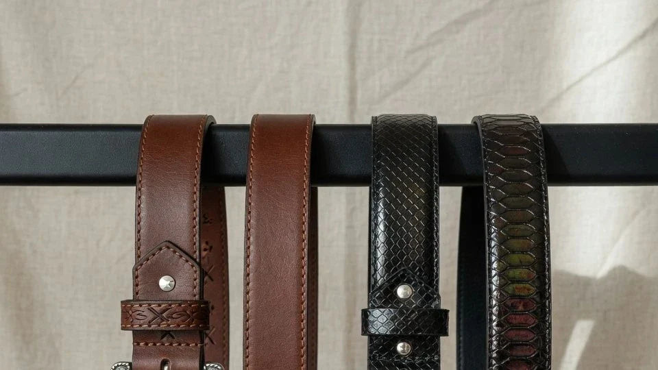 Women's western-inspired belt and reptile-texture belt shown side by side for a style comparison