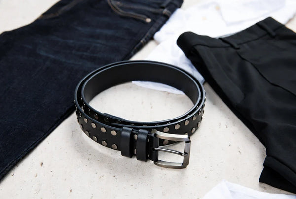 Black leather studded belt styled with denim and tailored wardrobe pieces for a fit check guide