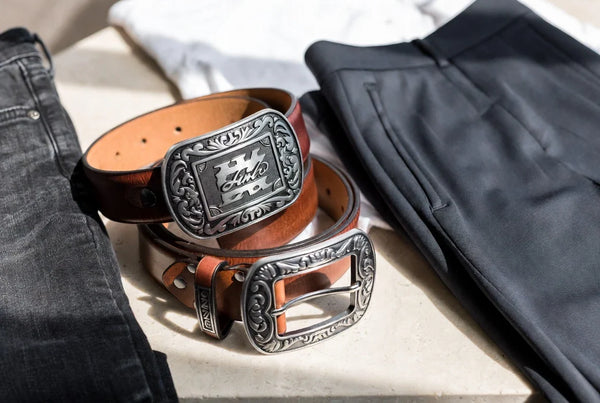 Western belts styled with denim and tailored trousers to show balanced buckle size and belt width