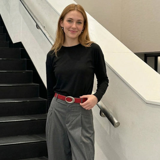 Red croc-embossed casual belt styled with grey trousers for a smart-casual look alternate view