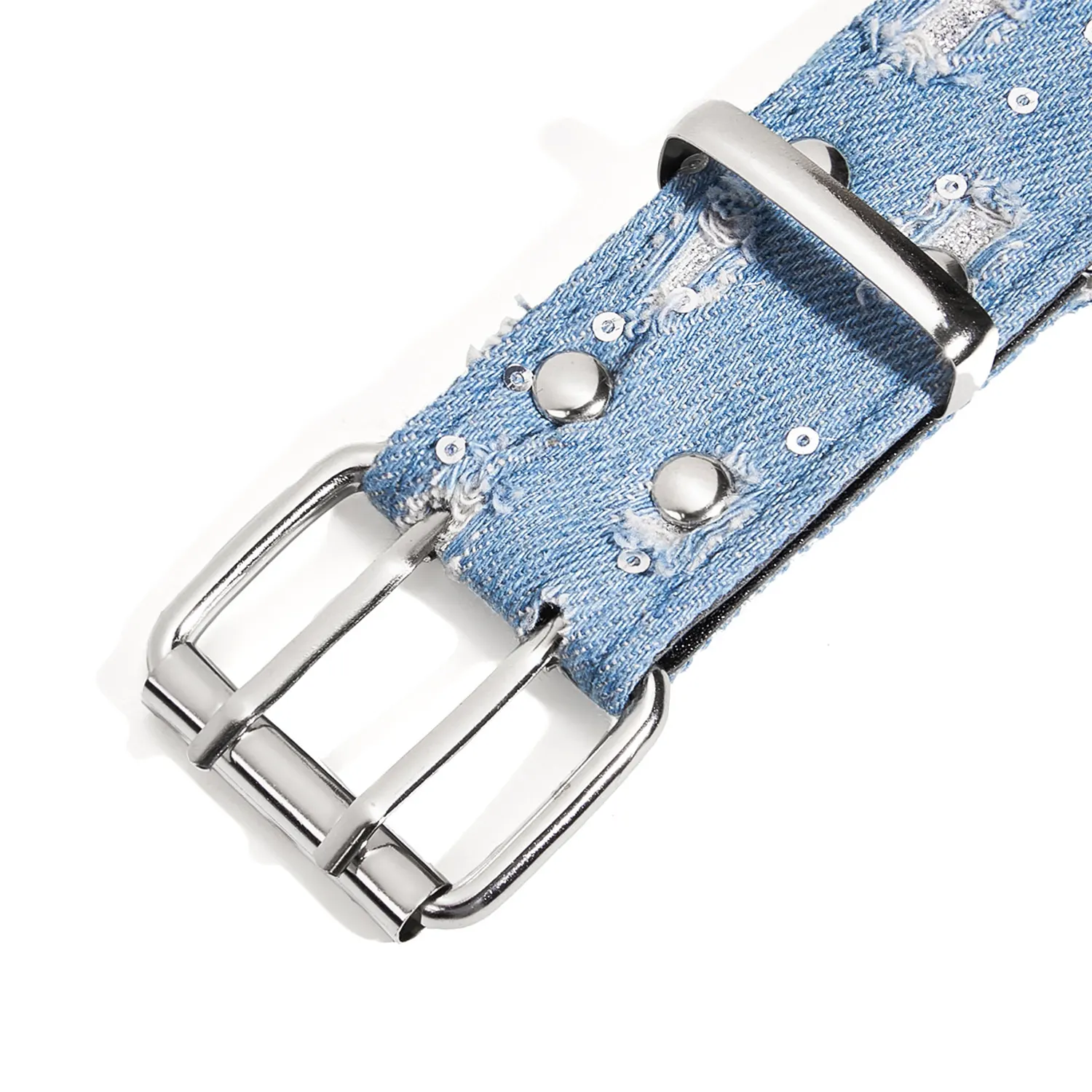 Close-up of the silver-tone double-prong buckle, star studs, and distressed blue denim on a cowgirl belt