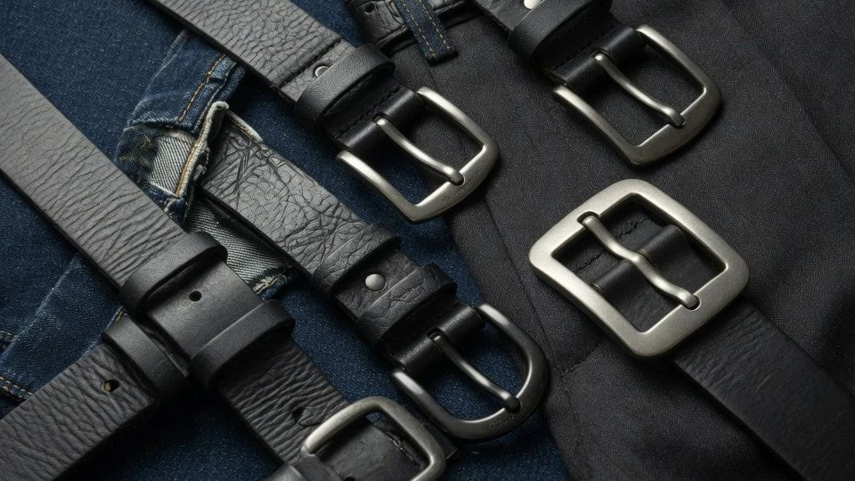 Black belts in different widths displayed on denim and trousers to show loop fit and proportion