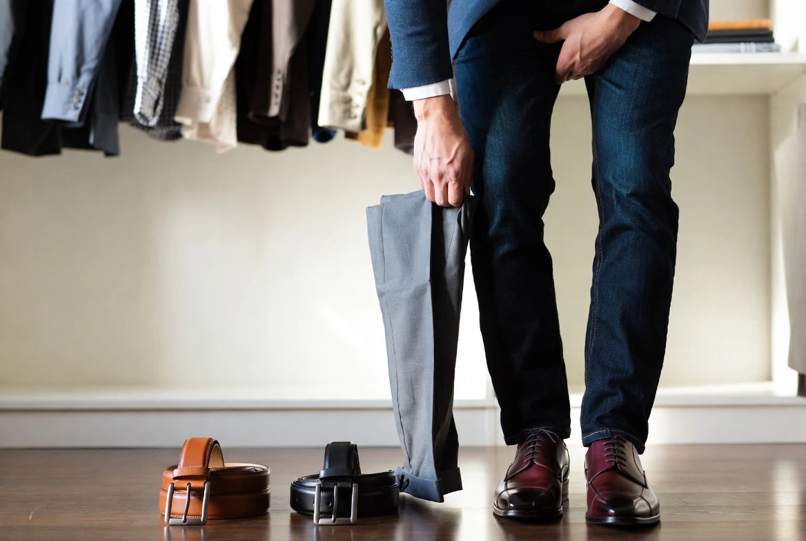 Wardrobe scene comparing leather belt choices for tailored and casual outfits