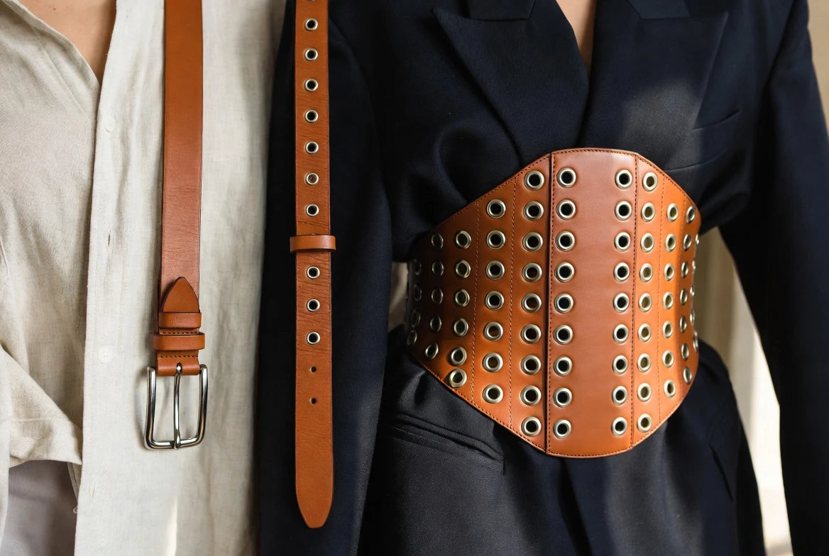 Comparison of slim, medium, and wide corset belt styles over tailored clothing