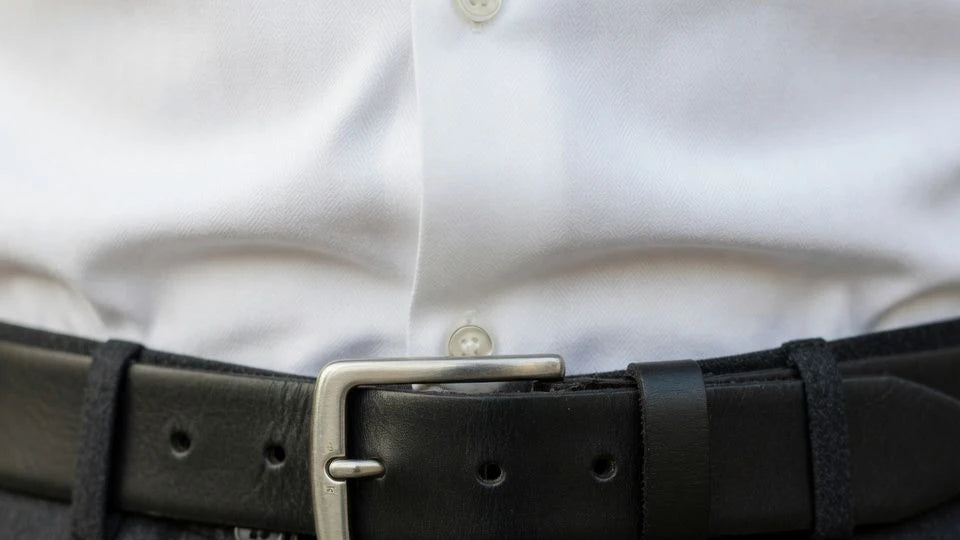 Men's leather belt showing correct middle-hole fit and short tail length